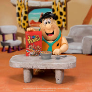 abba-Dabba-Doo ! Bring a taste of Bedrock breakfast nostalgia to your collection with the Fruity Pebbles Fred Flintstone 1:12 Scale Action Figure by Jada Toys! This highly detailed collectible captures everyone's favorite Stone Age dad, Fred Flintstone, ready to start the day with a bowl of delicious Fruity Pebbles. Expertly crafted in 1:12 scale, this figure perfectly recreates Fred's signature orange-spotted tunic, cheerful grin, and larger-than-life personality. With premium articulation, collectors can 