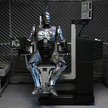 Load image into Gallery viewer, RoboCop 7&quot; Scale Figures - Ultimate Battle Damaged RoboCop w/ Chair Maple and Mangoes
