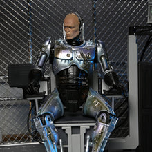 Load image into Gallery viewer, RoboCop 7&quot; Scale Figures - Ultimate Battle Damaged RoboCop w/ Chair Maple and Mangoes
